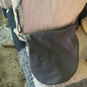A New Day bag. Pebbled gray. Can be crossbody